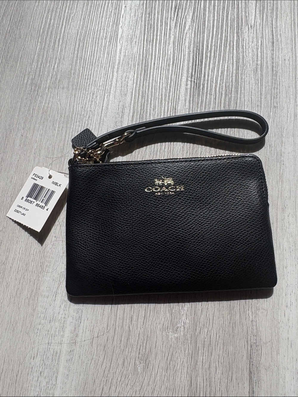 Coach Black Pebbled Leather Wristlet with Gold Logo